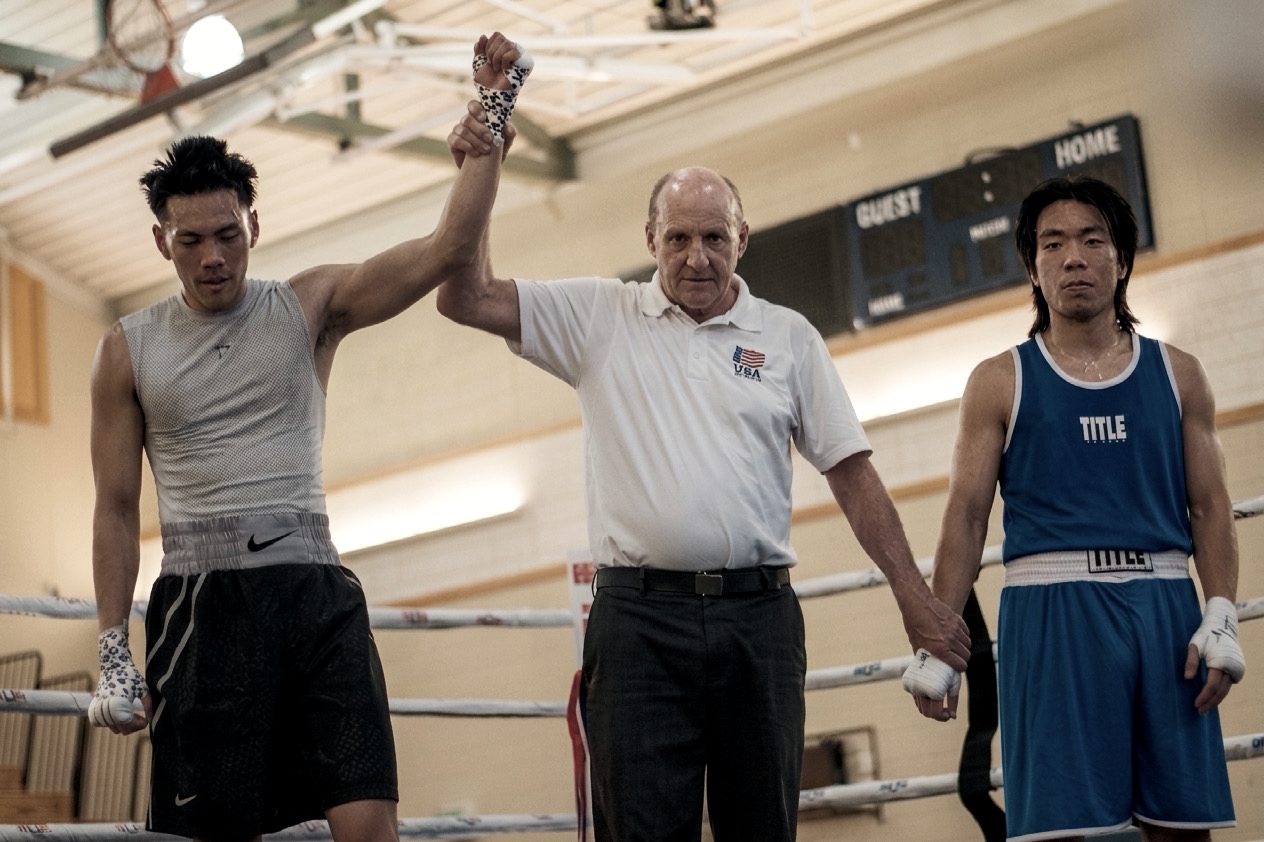 A Mabuhay boxer getting his hand raised after an amateur bout